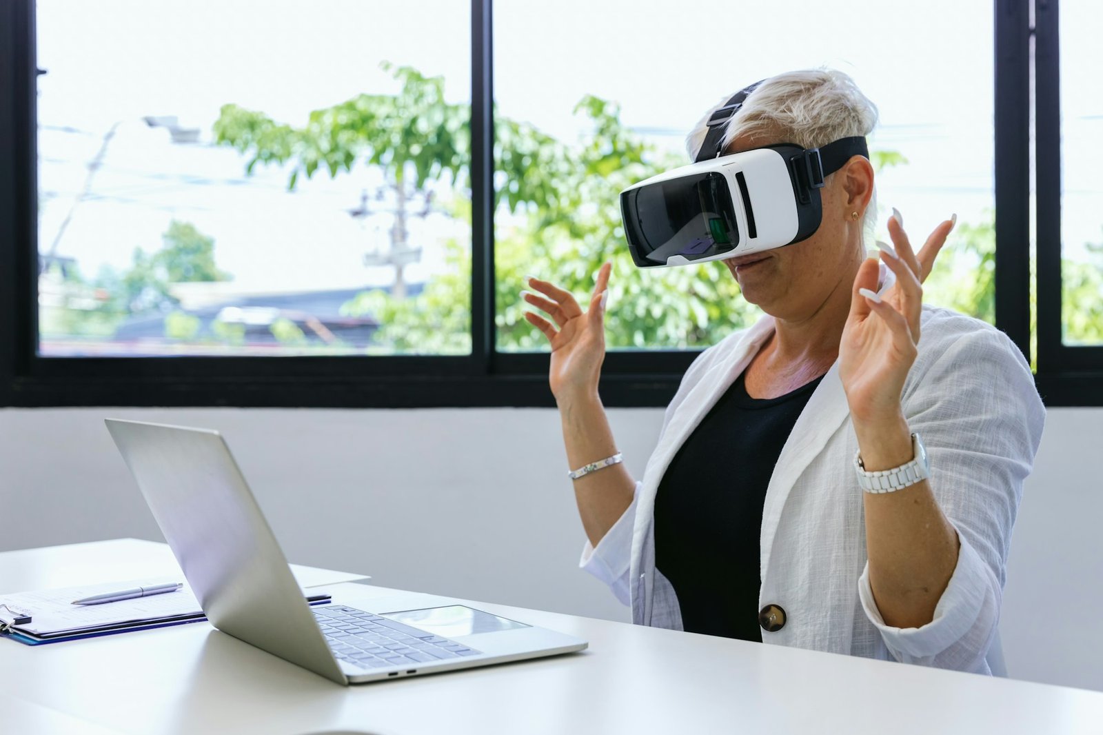 Business Woman in VR headset. Woman using VR glasses for online game.