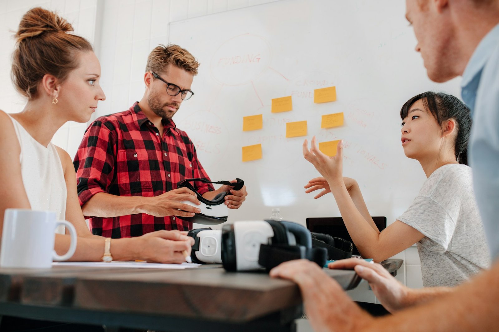 People in meeting room with augmented reality devices