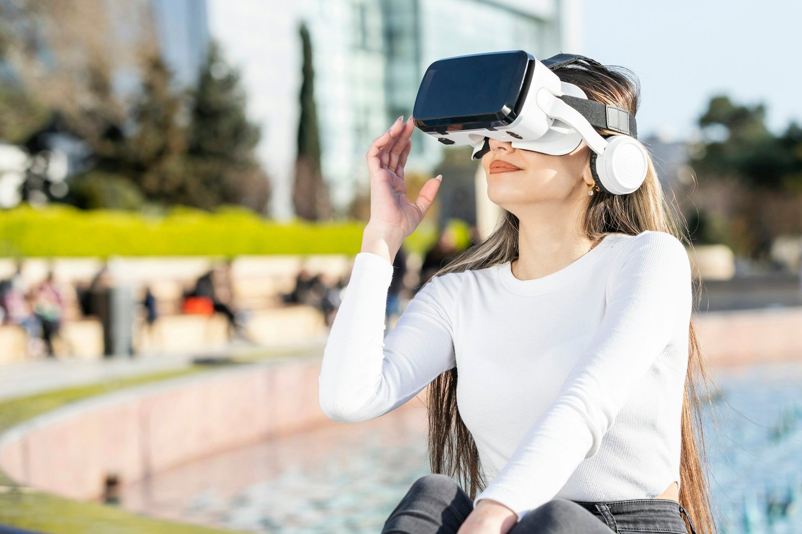 Young girl wearing vr set and sitting at the park